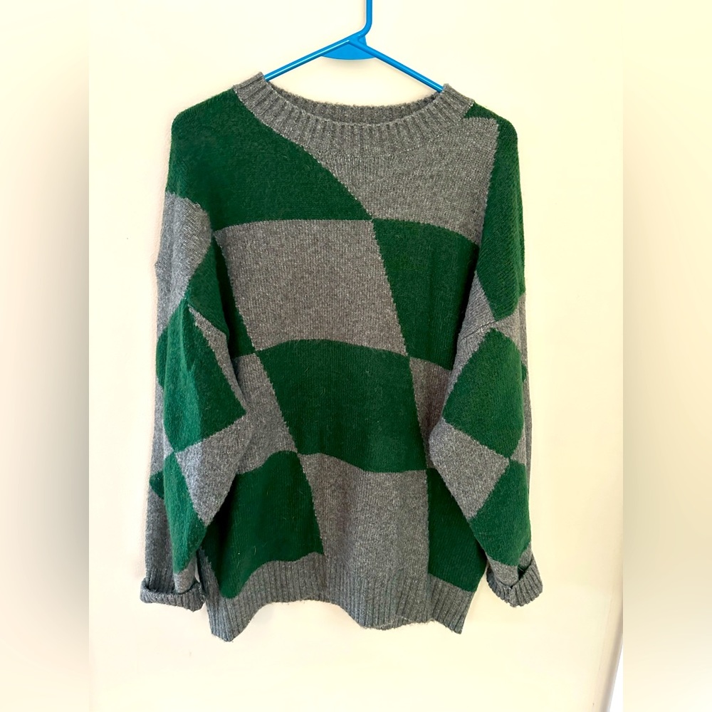 Get game day ready with this cozy, oversized sweater.